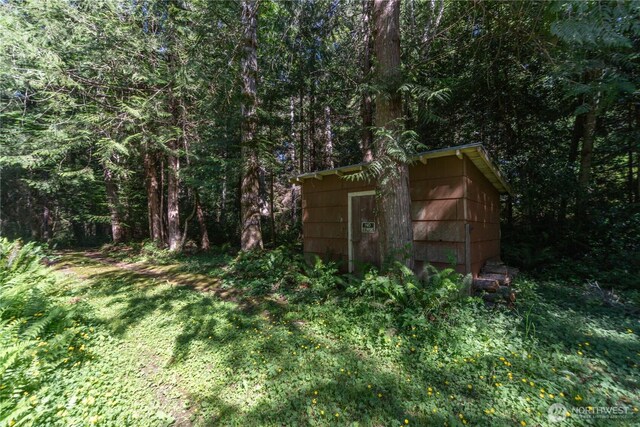 160 Wildwood Shrs, Brinnon, WA 98320 - view of shed with a wooded view