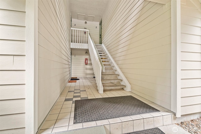 4617 Grandview Dr W Unit D, Tacoma, WA 98466 - stairway featuring wood walls and tile patterned floors