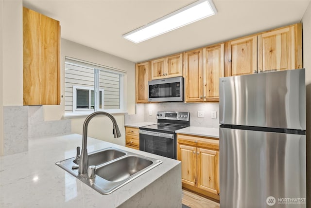 4617 Grandview Dr W Unit D, Tacoma, WA 98466 - kitchen with appliances with stainless steel finishes, light brown cabinets, and backsplash