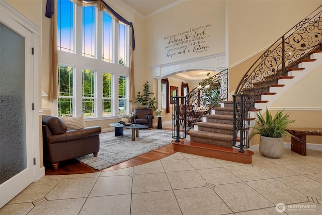 24702 64th Ave E, Graham, WA 98338 - tiled entryway featuring a high ceiling, stairway, and crown molding