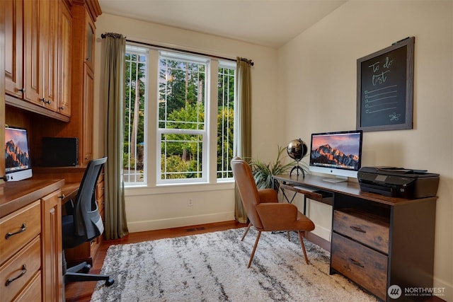 24702 64th Ave E, Graham, WA 98338 - office area featuring wood finished floors and built in study area