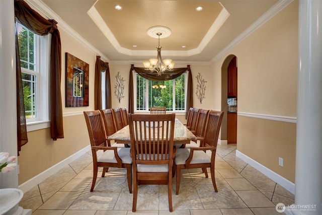 24702 64th Ave E, Graham, WA 98338 - dining room with healthy amount of natural light, a chandelier, a raised ceiling, arched walkways, and ornamental molding