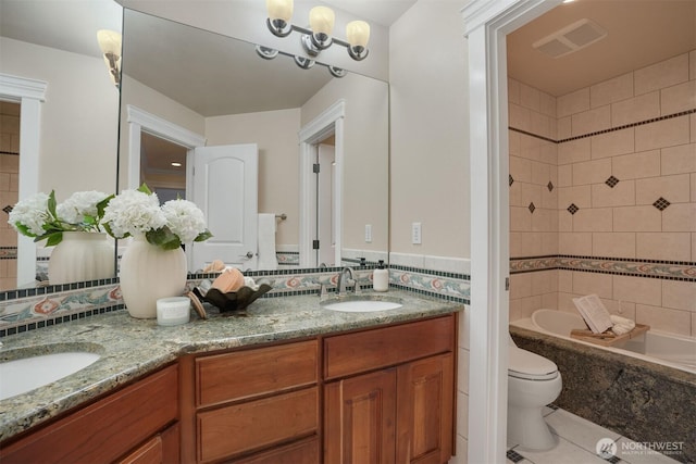 24702 64th Ave E, Graham, WA 98338 - full bathroom featuring double vanity, tile patterned flooring, and a combined bath / shower with marble appearance