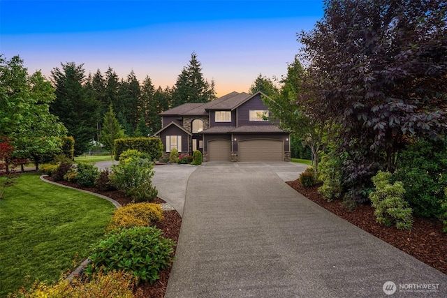 24702 64th Ave E, Graham, WA 98338 - view of front of home featuring concrete driveway, an attached garage, and a yard