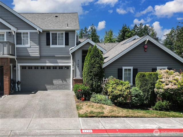 4196 248th Ct SE Unit 62, Sammamish, WA 98029 - view of front of property featuring roof with shingles, a garage, driveway, and brick siding