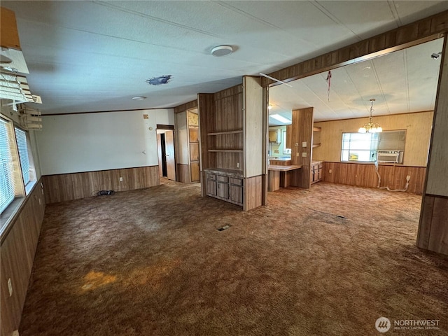 31600 126th Ave SE Unit 100, Auburn, WA 98092 - unfurnished living room with wood walls, carpet floors, wainscoting, a chandelier, and cooling unit