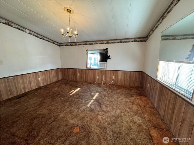 31600 126th Ave SE Unit 100, Auburn, WA 98092 - carpeted empty room featuring a wainscoted wall, plenty of natural light, wood walls, a chandelier, and cooling unit