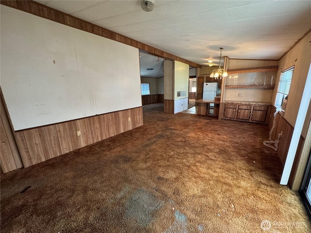 31600 126th Ave SE Unit 100, Auburn, WA 98092 - unfurnished dining area with wood walls, carpet floors, and wainscoting