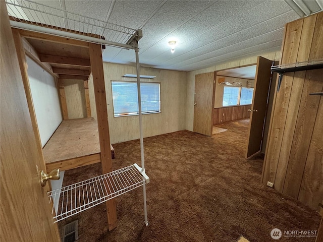 31600 126th Ave SE Unit 100, Auburn, WA 98092 - unfurnished bedroom featuring wood walls and carpet floors
