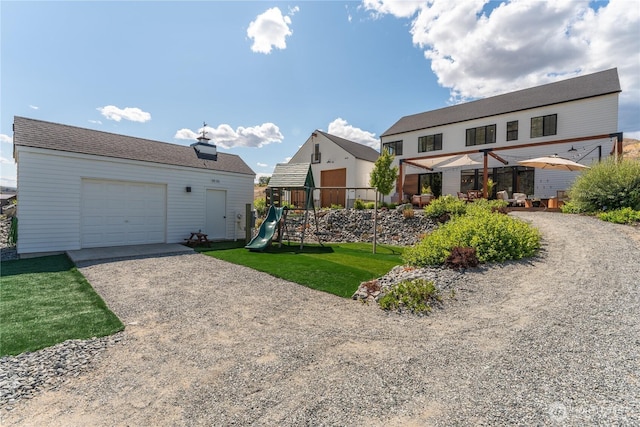 485 Hidden Ln, Chelan, WA 98816 - view of front facade featuring a playground, driveway, and a front yard
