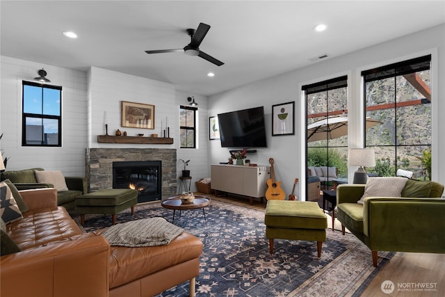 485 Hidden Ln, Chelan, WA 98816 - living area with wood finished floors, a ceiling fan, a fireplace, and recessed lighting