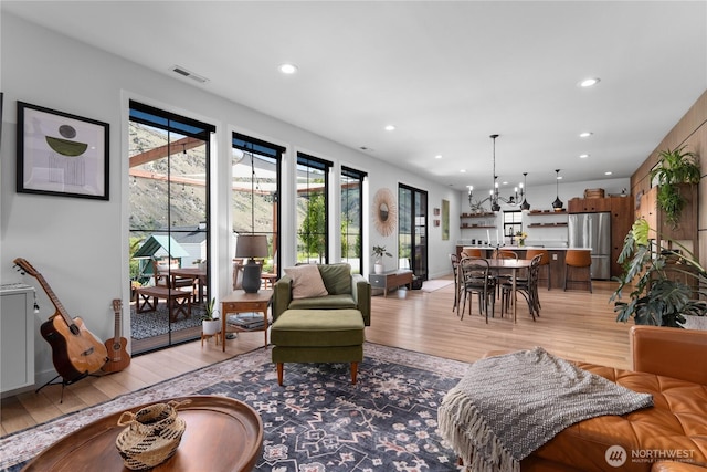 485 Hidden Ln, Chelan, WA 98816 - living area featuring light wood-type flooring, a chandelier, and recessed lighting
