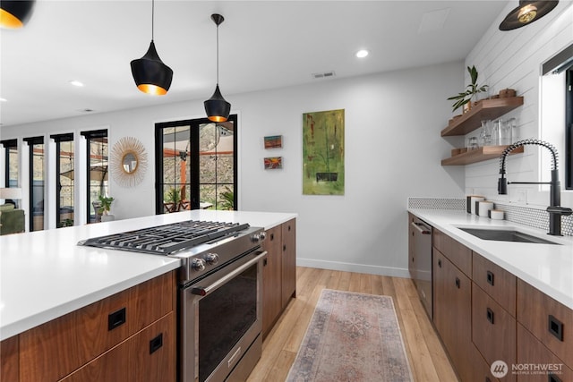 485 Hidden Ln, Chelan, WA 98816 - kitchen featuring stainless steel appliances, open shelves, light countertops, light wood finished floors, and recessed lighting