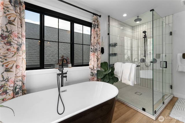 485 Hidden Ln, Chelan, WA 98816 - full bathroom with a shower stall, wood finished floors, a freestanding bath, and recessed lighting