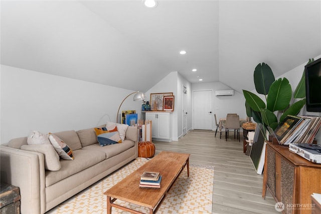 485 Hidden Ln, Chelan, WA 98816 - living area with light wood finished floors, vaulted ceiling, recessed lighting, and a wall unit AC