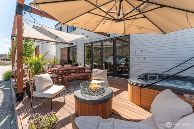 485 Hidden Ln, Chelan, WA 98816 - wooden deck with a hot tub, outdoor dining space, and an outdoor fire pit