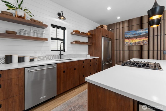 485 Hidden Ln, Chelan, WA 98816 - kitchen featuring appliances with stainless steel finishes, open shelves, light wood finished floors, light countertops, and recessed lighting