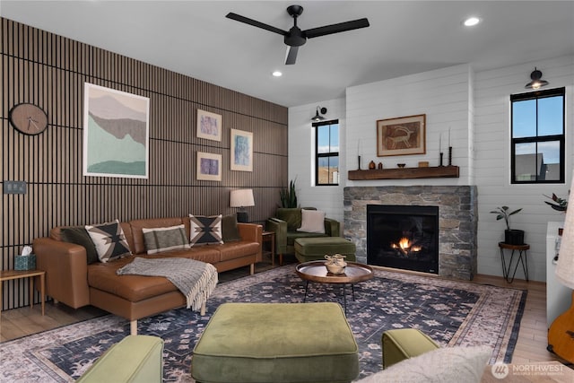 485 Hidden Ln, Chelan, WA 98816 - living area featuring wood finished floors, a ceiling fan, a stone fireplace, and recessed lighting