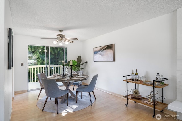 33513 35th Ave SW, Federal Way, WA 98023 - dining room with light wood-type flooring, a textured ceiling, and ceiling fan