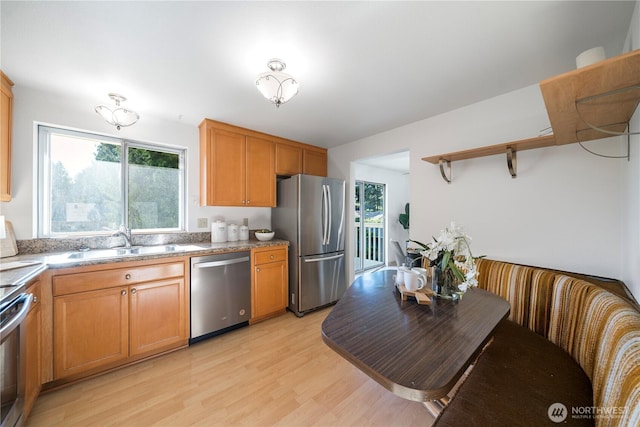 33513 35th Ave SW, Federal Way, WA 98023 - kitchen featuring stainless steel appliances, open shelves, light wood-style flooring, and brown cabinetry