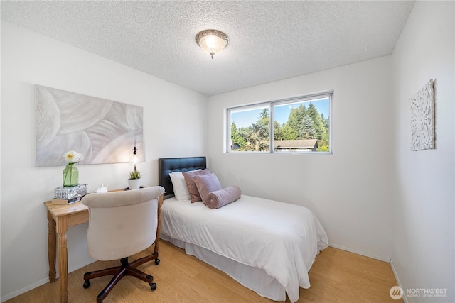 33513 35th Ave SW, Federal Way, WA 98023 - bedroom with a textured ceiling, wood finished floors, and an office area