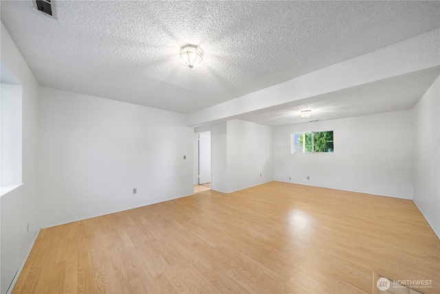33513 35th Ave SW, Federal Way, WA 98023 - spare room featuring light wood finished floors and a textured ceiling