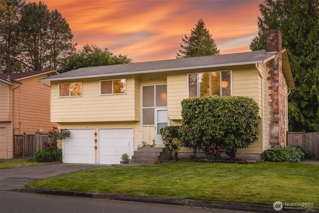 33513 35th Ave SW, Federal Way, WA 98023 - raised ranch with asphalt driveway, a chimney, and a garage