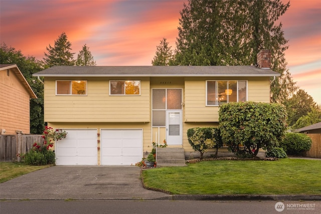 33513 35th Ave SW, Federal Way, WA 98023 - bi-level home with a garage, a chimney, and asphalt driveway