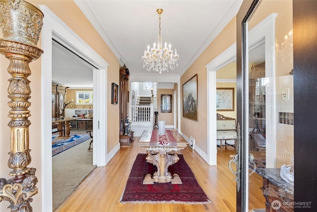 4410 N 45th St, Tacoma, WA 98407 - corridor featuring light wood-style flooring, a chandelier, stairway, and crown molding