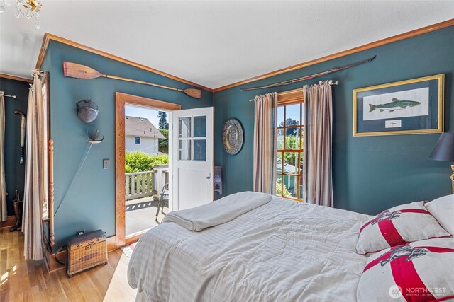 4410 N 45th St, Tacoma, WA 98407 - bedroom with access to exterior, ornamental molding, multiple windows, and wood finished floors
