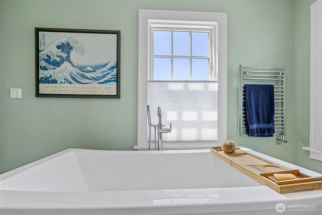 4410 N 45th St, Tacoma, WA 98407 - bathroom with a towel warmer, a soaking tub, and radiator heating unit