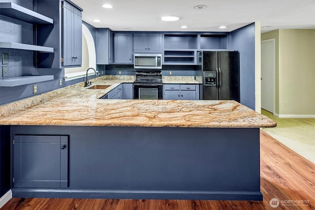 25321 133rd Ave NE, Arlington, WA 98223 - kitchen featuring open shelves, black appliances, a peninsula, light stone counters, and dark wood-style floors