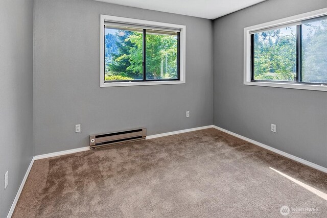 25321 133rd Ave NE, Arlington, WA 98223 - unfurnished room featuring a baseboard radiator and carpet