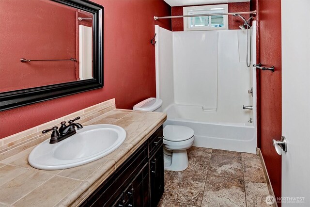 25321 133rd Ave NE, Arlington, WA 98223 - bathroom with vanity, washtub / shower combination, and stone finish floors