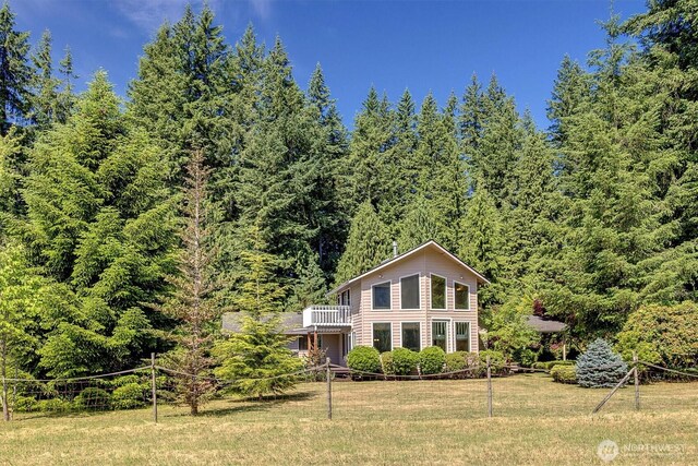 25321 133rd Ave NE, Arlington, WA 98223 - back of house featuring a wooded view, a yard, and a balcony