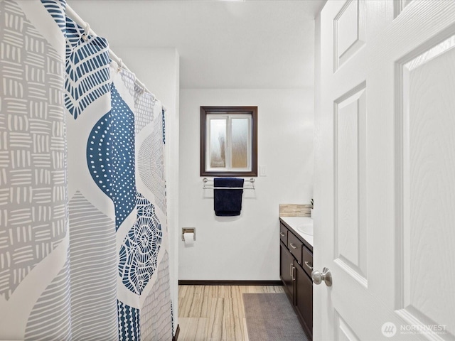 7102 Church Creek Cir NW, Stanwood, WA 98292 - full bath with vanity, wood finished floors, and a shower with curtain