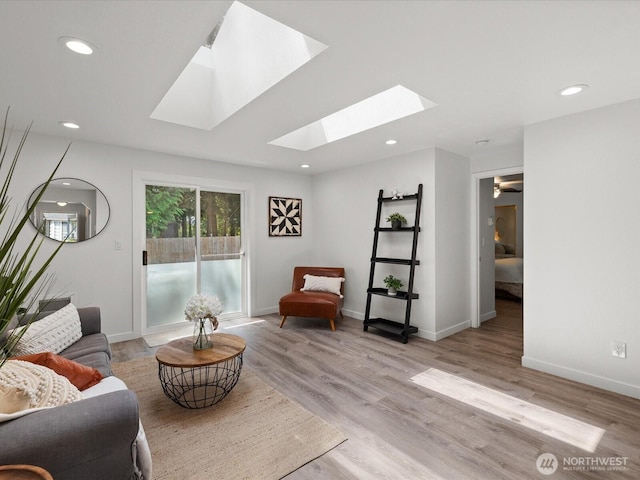 7102 Church Creek Cir NW, Stanwood, WA 98292 - sitting room with a skylight, light wood-type flooring, and recessed lighting