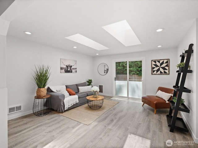 7102 Church Creek Cir NW, Stanwood, WA 98292 - living area featuring a skylight, wood finished floors, and recessed lighting