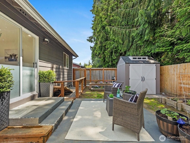 7102 Church Creek Cir NW, Stanwood, WA 98292 - fenced backyard featuring a patio area, a shed, and a vegetable garden