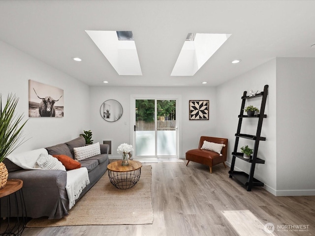 7102 Church Creek Cir NW, Stanwood, WA 98292 - living area featuring a skylight, light wood-style floors, and recessed lighting