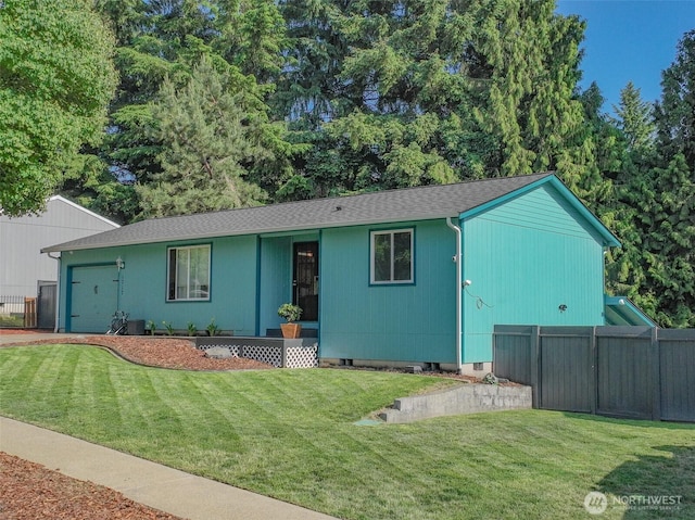1717 14th Ave SE, Olympia, WA 98501 - view of front facade featuring a garage and a shingled roof