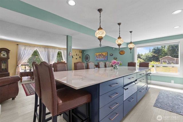 6830 SE Arlington Pl, Port Orchard, WA 98367 - kitchen with plenty of natural light, a kitchen breakfast bar, pendant lighting, recessed lighting, and open floor plan