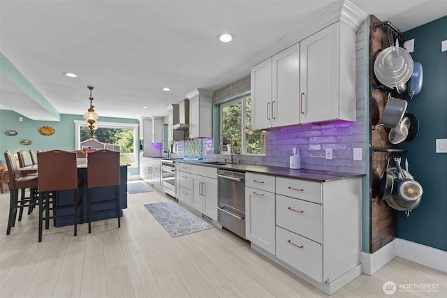 6830 SE Arlington Pl, Port Orchard, WA 98367 - kitchen featuring dishwasher, tasteful backsplash, recessed lighting, white cabinets, and dark countertops