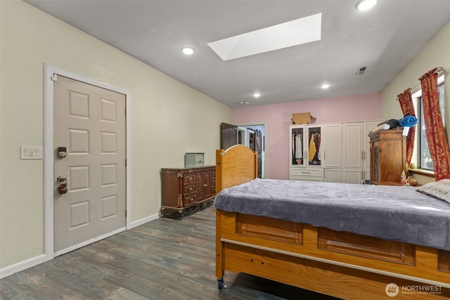 6830 SE Arlington Pl, Port Orchard, WA 98367 - bedroom featuring a skylight, dark wood-style flooring, and recessed lighting