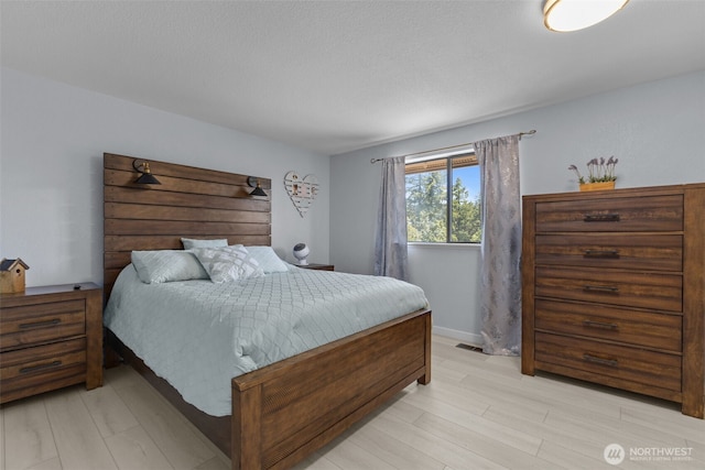 6830 SE Arlington Pl, Port Orchard, WA 98367 - bedroom with light wood finished floors