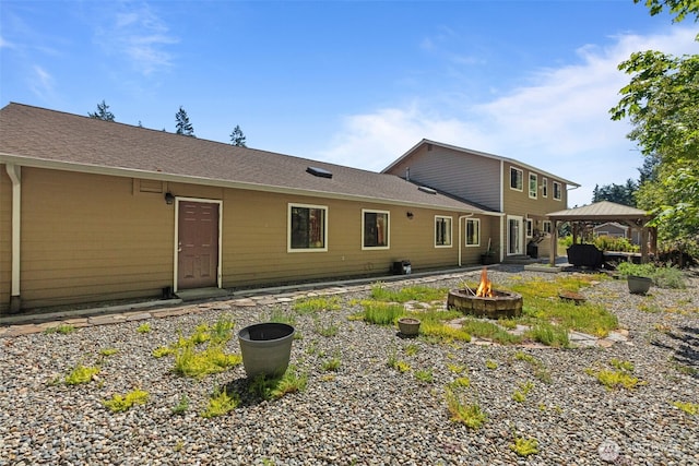 6830 SE Arlington Pl, Port Orchard, WA 98367 - back of house with a gazebo and an outdoor fire pit