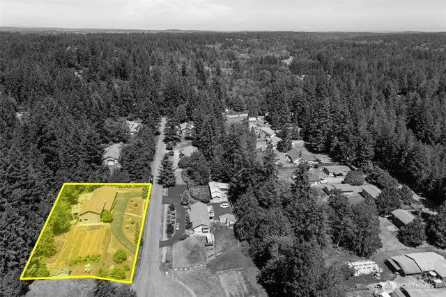 6830 SE Arlington Pl, Port Orchard, WA 98367 - aerial perspective of suburban area featuring a heavily wooded area and property parcel outlined