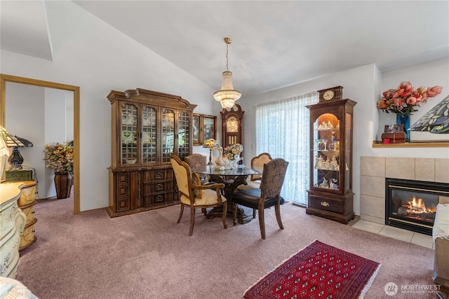9923 74th Ave E, Puyallup, WA 98373 - carpeted dining area featuring a tiled fireplace and lofted ceiling