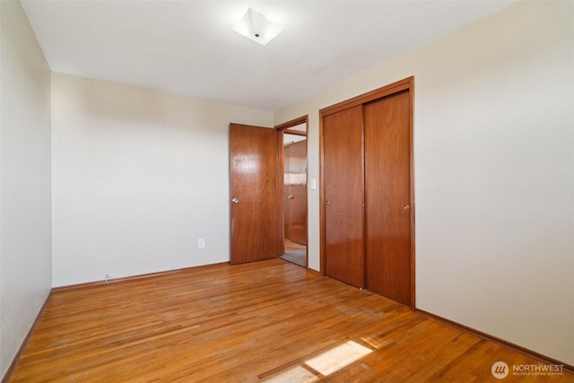 411 15th Ave, Milton, WA 98354 - unfurnished bedroom featuring a closet and light wood-style flooring