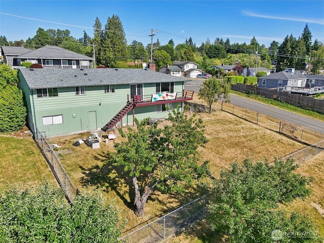 411 15th Ave, Milton, WA 98354 - back of property with stairway, a wooden deck, a fenced backyard, and a residential view